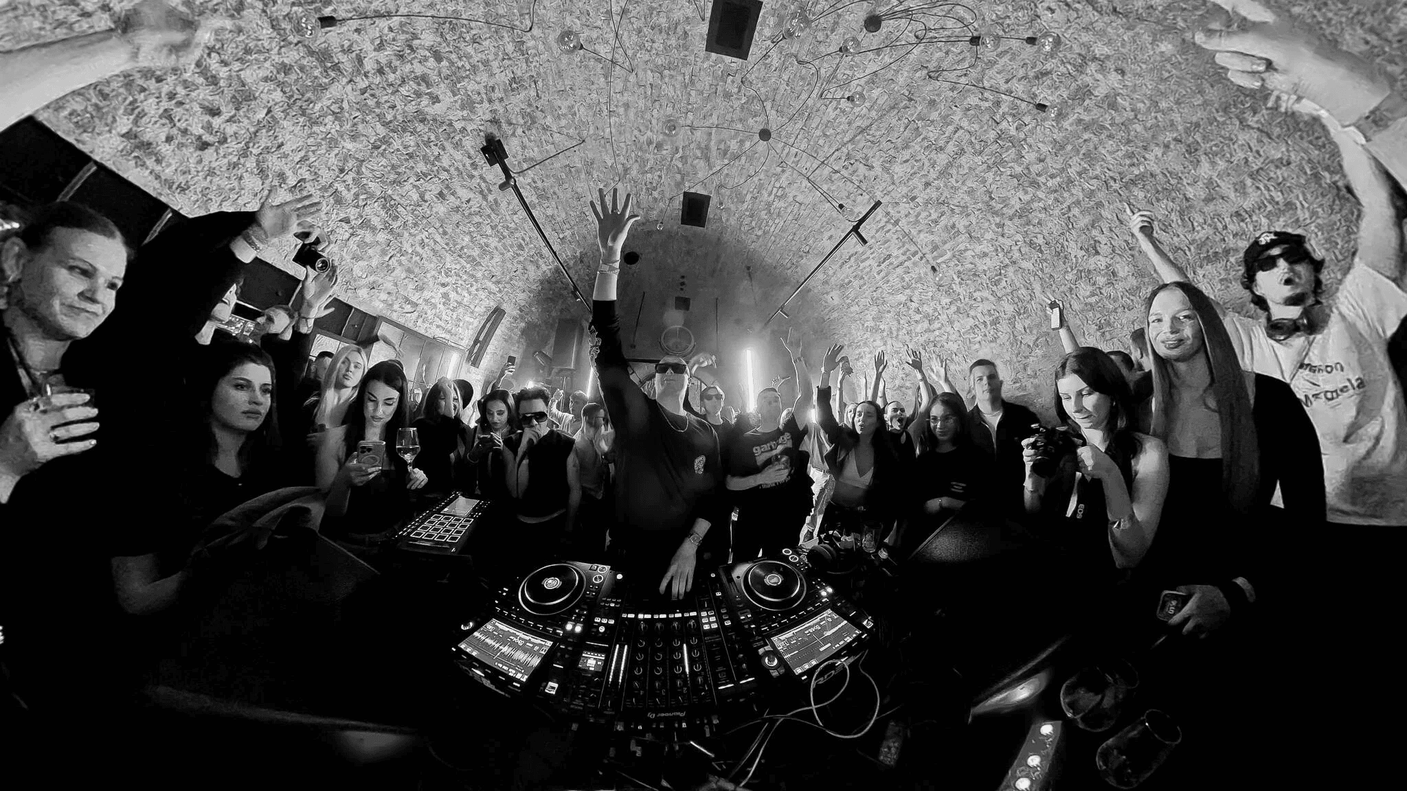 DJ performing at turntables